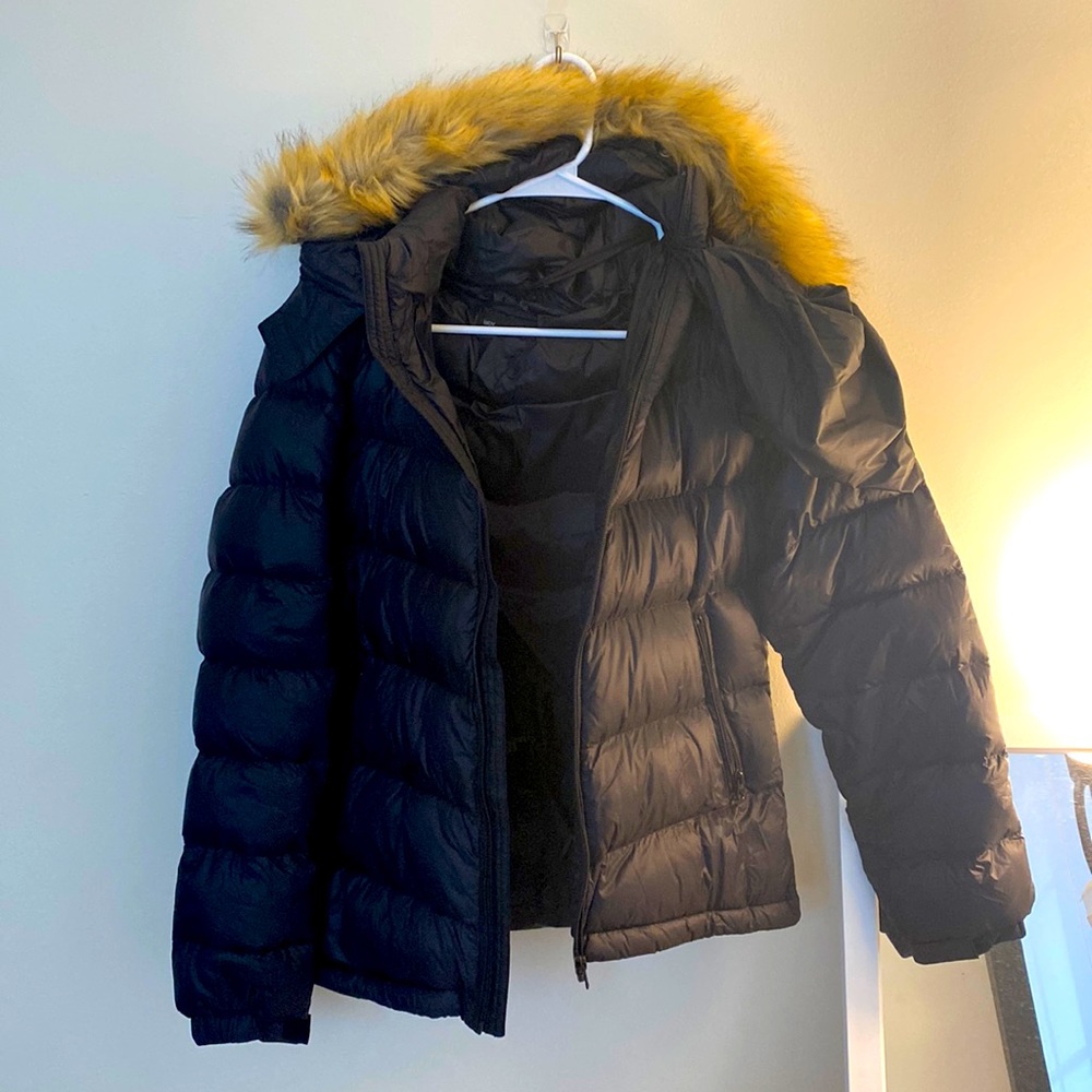 Black puffer with storage bag